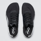 Black athletic shoes with a brand logo on a light gray background