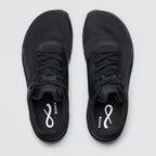 Black athletic shoes with a brand logo on a light gray background