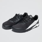 Black athletic shoes with a white sole on a light gray background